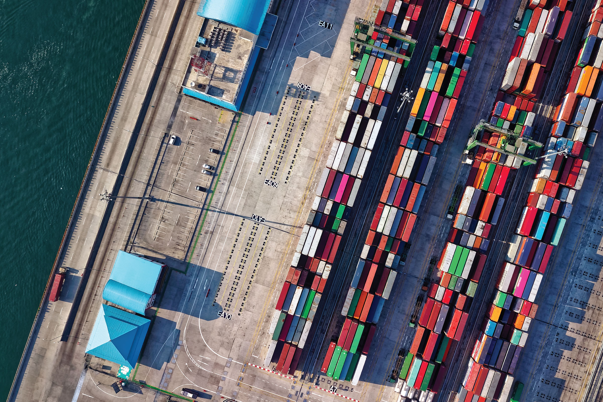 Aerial shot of a port with lots of containers.
